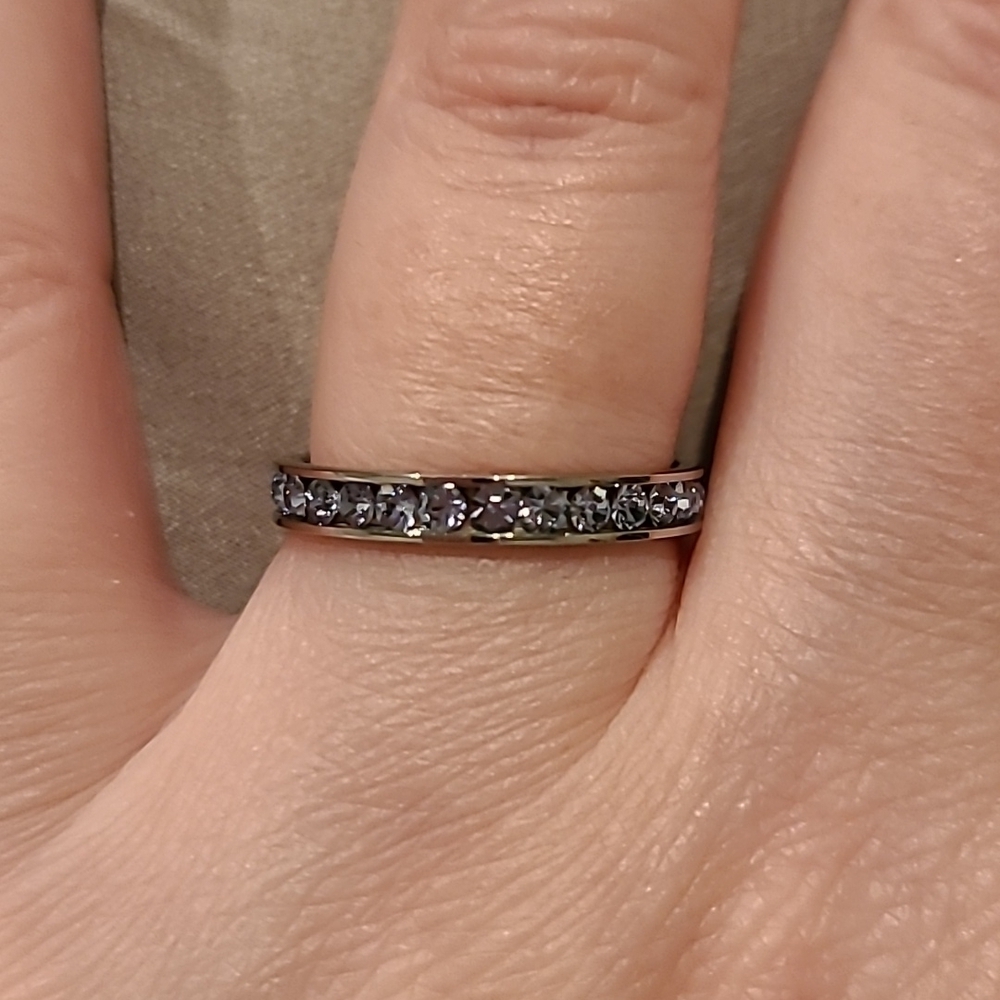 Light blue cubic zirconia channel set eternity stainless steel ring